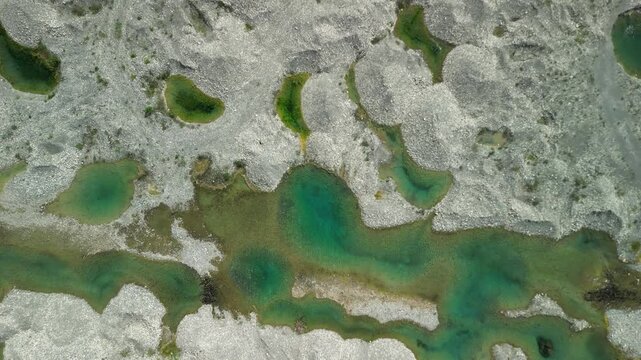 Top‑down orbit around a vivid blue basin, emphasizing geometry and color&mdash;excellent for motion‑graphics masks or TV weather intros. Filmed 30 June 2025, San Cristobal, Dominican Republic