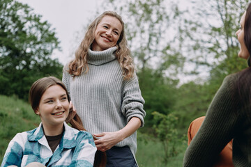 Smiling middle age woman outdoors enjoying healthy active lifestyle with community and wellbeing...