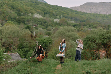 Active middle age woman hiking with friends outdoors in lush green nature, enjoying healthy...