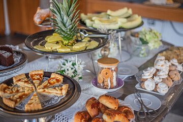 Breakfast buffet with fresh fruits and pastries