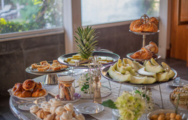 Breakfast buffet with fresh fruits and pastries