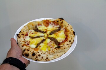 The most authentic Neapolitan pizza with anchovies, anchovies from the Mediterranean Sea, extra virgin olive oil and buffalo mozzarella cheese