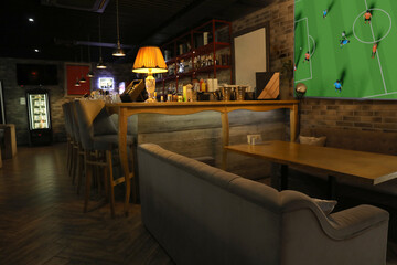 Broadcasting soccer match on TV set in bar