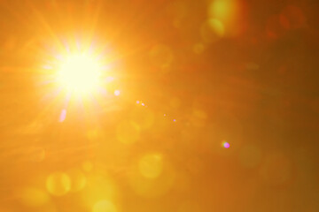 Fototapeta premium Bright sun in orange sky during hot summer weather. Extremely high temperature