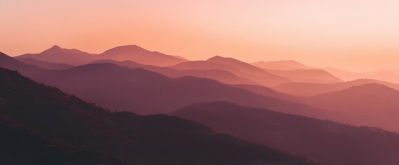 Obraz premium Misty Mountain Layers at Sunrise, Pink Sky, Horizon Landscape, Gradient Hues