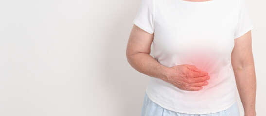 Elderly woman having abdomen aches for Stomach pain, digestion with constipation or Diarrhea from food poisoning, female problem and Endometriosis, Hysterectomy, Stomachache and Menstrual concept