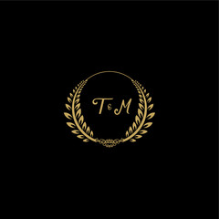 Fototapeta premium TM beautiful feminine and elegant wedding monogram initial logo with circle floral gold
