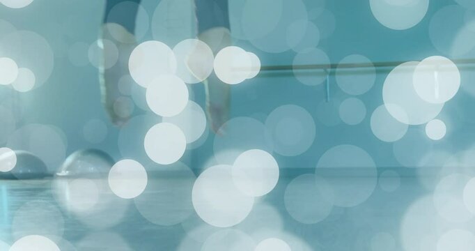 Opening at barre, dancer practicing footwork shifting, sliding, rising en pointe and returning