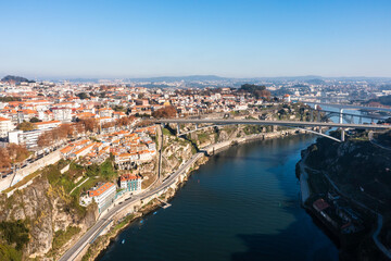 Obraz premium Cityscape of the city of Porto, including the Douro river and the Dom Luis I bridge (Ponte de Dom Luís I). Porto, Portugal.