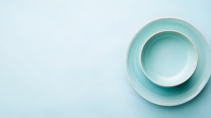Empty Light Blue Ceramic Bowl and Plate on Pastel Background