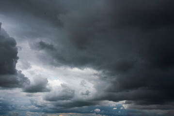 Dramatic dark storm thundercloud rain clouds on black sky background. Dark thunderstorm clouds...