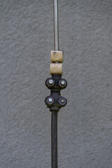 Labeled down conductor for a lightning protection system, captured in natural outdoor light,...