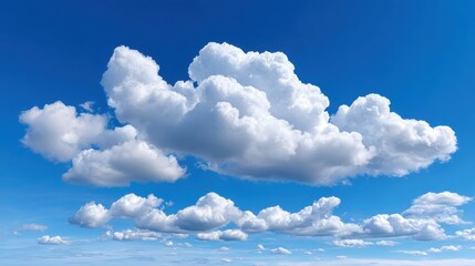 Fluffy White Clouds Against a Bright Blue Sky in Daylight