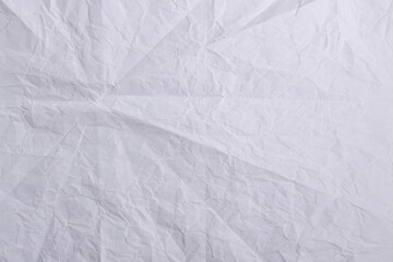Folded Wrinkled White Paper Texture Background for Vintage and Grunge Design


