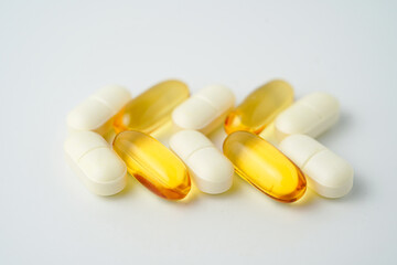 Clock made of pills capsules, pills form a circle, omega, vitamins, Cod liver oil, supplements