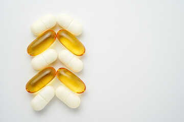 Clock made of pills capsules, pills form a circle, omega, vitamins, Cod liver oil, supplements