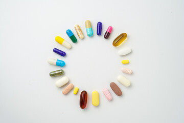 Clock made of pills capsules, pills form a circle, omega, vitamins, Cod liver oil, supplements