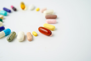 Clock made of pills capsules, pills form a circle, omega, vitamins, Cod liver oil, supplements