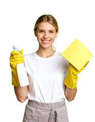 Smiling cleaning lady holds a spray bottle and a yellow cloth. She wears yellow rubber gloves and a white t-shirt, and looks straight at the camera, isolated on transparent background