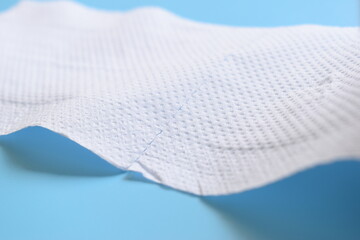 white paper tissue on blue background