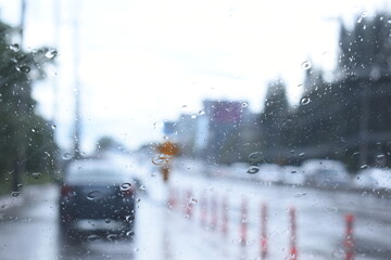 car on highway road with rainny season, blurred image