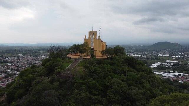 Aerial 4K Drone View of San Miguel Chapel on Hilltop in Atlixco, Mexico