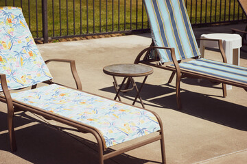 Retro outdoor lounge chairs by pool