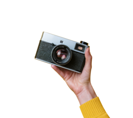 vintage camera held in hand on white background.