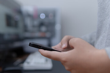 Close-up photograph of hands using a smartphone modern tech concept for business applications or lifestyle blogs