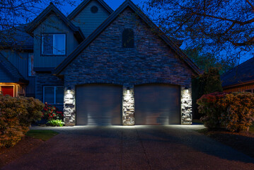 Garage door in luxury house with trees and nice landscape in Spring in Vancouver, Canada, North...