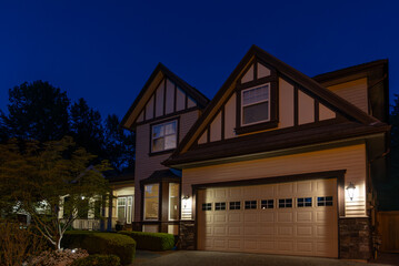 Garage door in luxury house with trees and nice landscape in Spring in Vancouver, Canada, North...