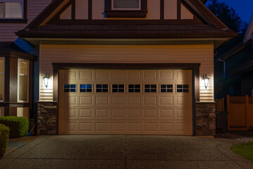 Garage door in luxury house with trees and nice landscape in Spring in Vancouver, Canada, North...