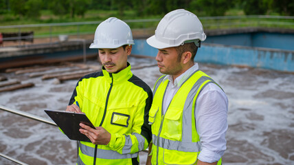 Wastewater treatment engineers are working together to develop a water filtration system for a wastewater treatment plant.