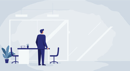 Obraz premium A businessman stands in a modern office, gazing out of the window, contemplating a decision, the interior design featuring minimalist furniture and a bright, airy atmosphere.