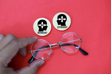 two sticks with introvert and extrovert icons, which is to be Ambivert