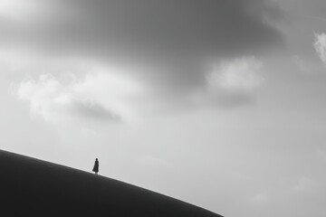 minimalist photograph human silhouette on rice terraces in indonesia under dramatic storm clouds