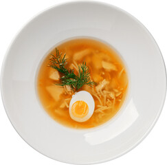 A comforting bowl of chicken soup with egg, dill, and noodles, ready to enjoy.