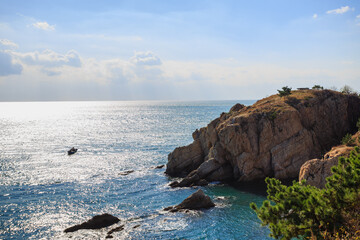 Calm blue sea and seaside rocks