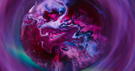 Flow texture. Round emulsion. Defocused red purple yellow colorful ink silver circle spreading on...