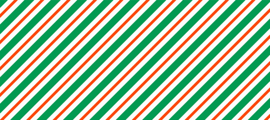 Bold vector pattern featuring diagonal stripes in green, orange, and white, creating a vibrant and energetic visual perfect for backgrounds, textiles, or modern design elements.