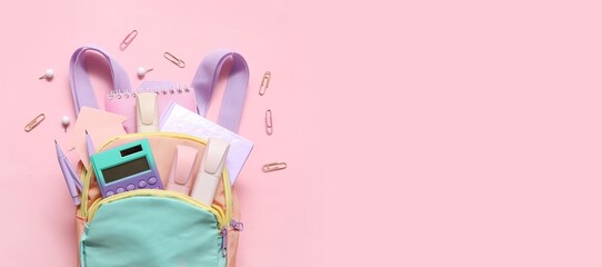 School backpack and stationery on pink background with space for text
