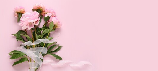 Bouquet of beautiful peony flowers on pink background with space for text