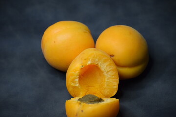 apricots on a black background