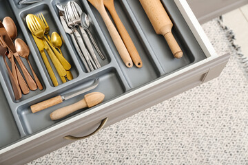 Open kitchen drawer with different cutlery