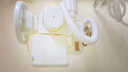 An intricate view of the mechanical and electronic components of an X-ray machine, showcasing the precision engineering that powers the diagnostic process in healthcare.