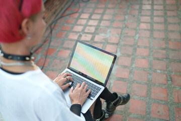 Gen z girl leather fashion with punk Asian woman working remotely on laptop digital nomad in...