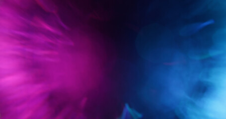 Glitter art. Bokeh circle. Defocused blue purple pink colorful radiant golden fluorescent lens flare moving on abstract neon blurred background.