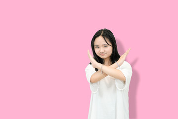 young asian woman gesturing no or rejection
