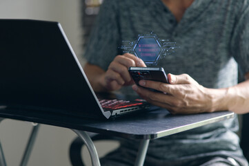 Person using smartphone and laptop with digital technology interface