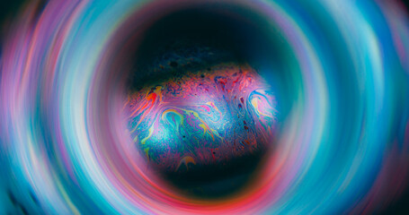 Gasoline defocused fluid. Mystical paint. Colorful light emulsion oil mix sphere. Blue red cosmic...